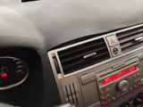 a car dashboard with a clock and radio in it