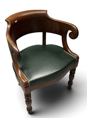 an image of a wooden chair with green leather upholstered