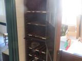 a wine rack in the corner of a kitchen