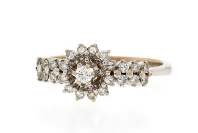 a close up of a diamond ring on a white background