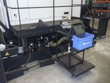 a picture of a machine in a warehouse with a lot of equipment