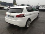 a white car that is parked in a parking lot