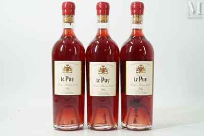 three bottles of wine sitting next to each other on a white surface