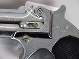 a gun that is sitting on top of a piece of paper