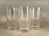 three glasses sitting on a table next to each other