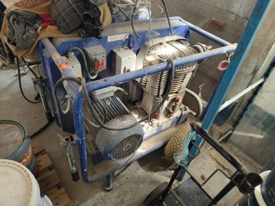 a small blue cart with a motor on top of it