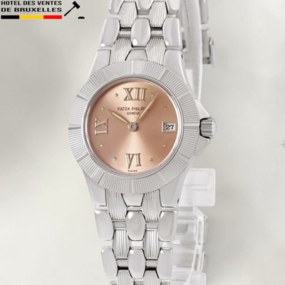 an image of a close up of a watch on a white surface