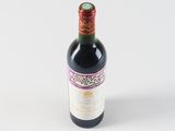 a bottle of wine that is sitting on a table