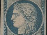 a blue and white stamp with a woman ' s face on it