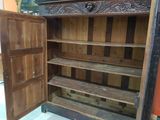 an old wooden cabinet with a door open