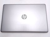 a silver laptop with a hp logo on the screen