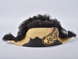 black and gold feathered hat with a mustache on top of it