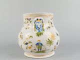 a white vase with a blue and yellow design on it