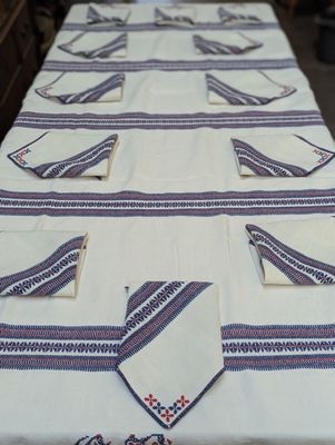 a long table with many napkins and napkins on it