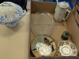 a box that has a bunch of plates and bowls in it
