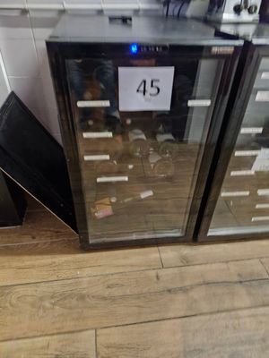 two wine coolers sitting next to each other on the floor