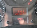 a digital clock on the dashboard of a car