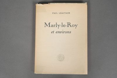 an old book sitting on top of a gray table