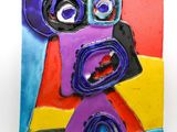 brightly colored ceramic sculpture of a face on a white background
