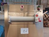 an image of a machine that is being used to make dough