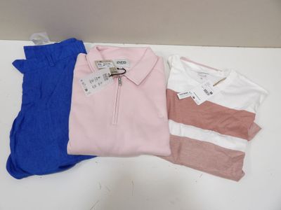 three polo shirts are sitting on a table next to each other