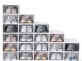 a stack of clear plastic boxes with shoes in them