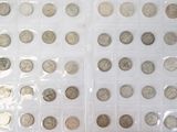 a lot of coins that are in a plastic case