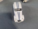 three toy cars that are sitting on a table