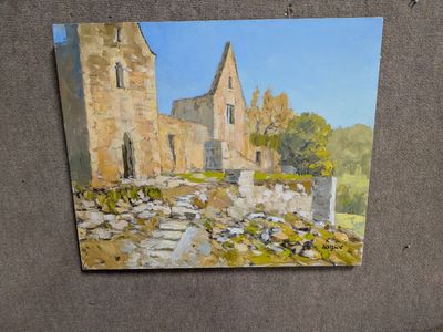 une peinture représentant un bâtiment, accrochée au mur d'un bâtiment