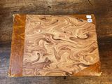 a close up of a piece of wood on a wooden table