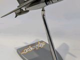 a model of a fighter jet sitting on a stand