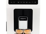 the krups coffee machine has two cups of coffee in front of it