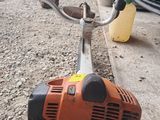 an image of a chainsaw sitting on the side of the road