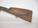an old gun with a wooden handle on a white background