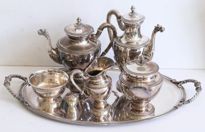 a silver tray with a silver tea set on it