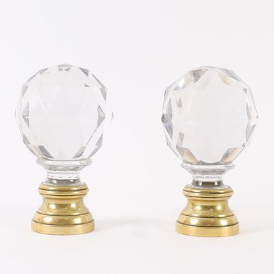 pair of crystal glass door knobs on brass bases
