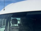 a white van that is parked on the side of the road