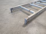 a metal ladder that is sitting on the floor