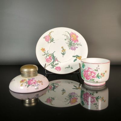 a small cup and saucer sitting on a table