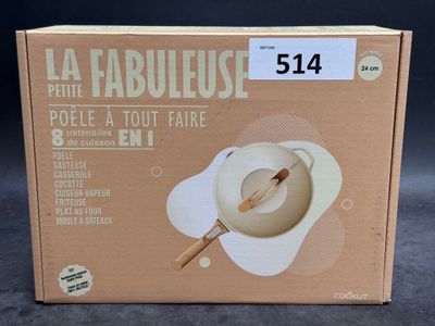 the box is open to show the contents of a bowl and spoon
