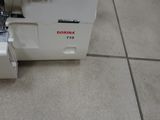 a sewing machine that is sitting on the floor