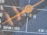 a close up of a clock on the dashboard of a car