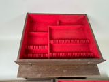 a wooden box with several compartments inside of it