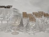 a lot of wine glasses that are sitting on a table