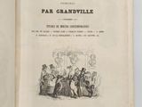 un livre ouvert sur lequel figure le dessin d'un groupe de personnes