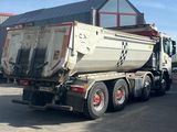 a truck that is parked in front of a building