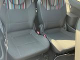 two seats in the back of a car with a seat belt