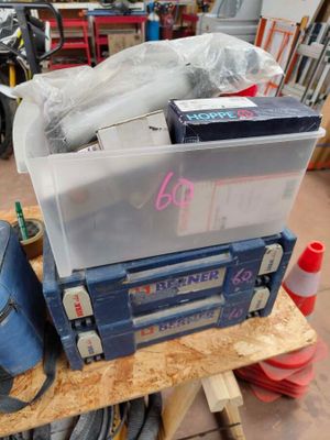 a blue tool box sitting on top of a workbench