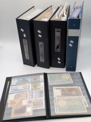 three black binders sitting on top of each other on a table
