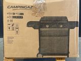 cardboard box with a picture of a grill inside of it on a pallet